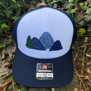 Handcrafted Blue Ridge Fabric Mountains trucker hat. Richardson 112. Made from Upcycled materials White/Navy