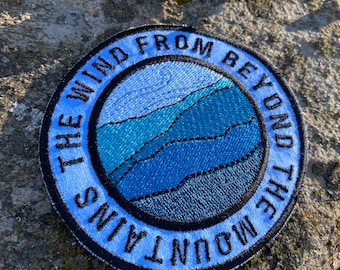 Tela handmade iron on patch.  The Wind from Beyond the Mountains. Custom embroidery