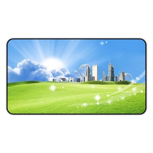 May include: A rectangular desk mat featuring a vibrant landscape with a bright green grassy field in the foreground, a clear blue sky with a radiant sun, and a distant city skyline with tall buildings and translucent circular orbs.