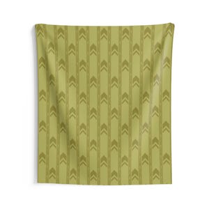 May include: A rectangular wall tapestry in a muted olive green shade featuring a repeating vertical pattern of darker olive green chevron arrows arranged in columns, separated by thin vertical lines, creating a structured geometric design.