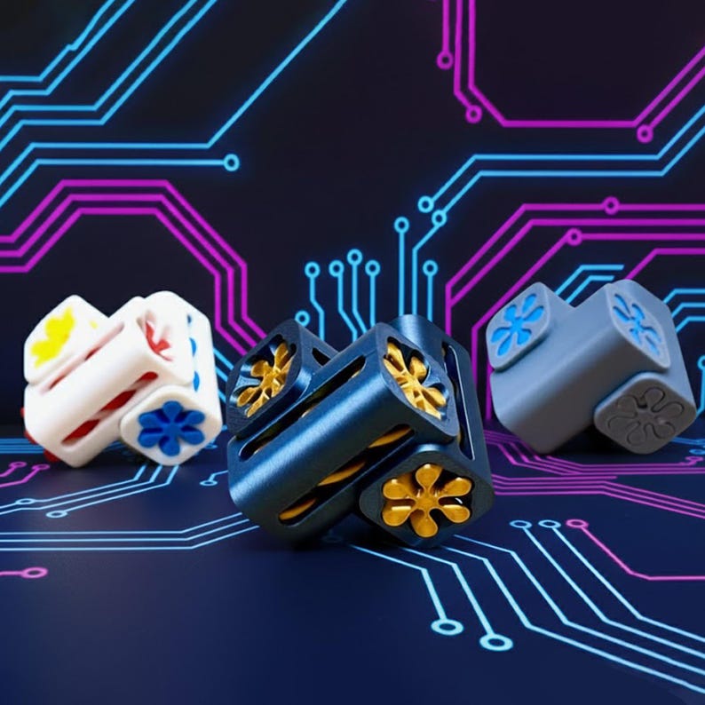 May include: Three geometric cube-shaped objects in white, blue, and gray, each with flower-like designs. The blue cube has gold accents. The background features a circuit board design with blue and purple lines.