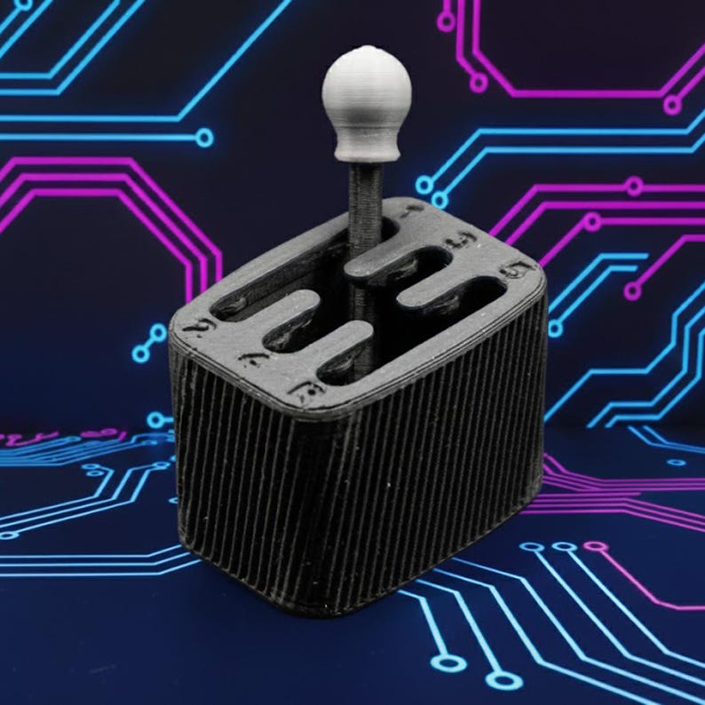 May include: A 3D-printed, gray gear shift knob with a white ball-shaped top. The gear shift is set in a black, rectangular housing with gear positions labeled. The background features a blue and purple circuit board design.