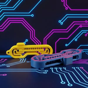 May include: Two 3D-printed key-shaped objects. One is yellow, the other is blue with a red interior. They are set against a dark background with a circuit board design in blue and purple.
