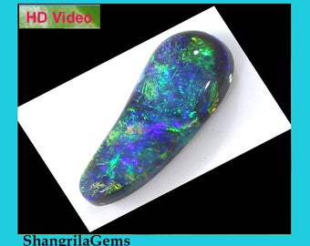 15mm 1.85ct Black opal Lightning Ridge blue, turquoise, green, orange fire.  15 by 5.75 by 4.1mm