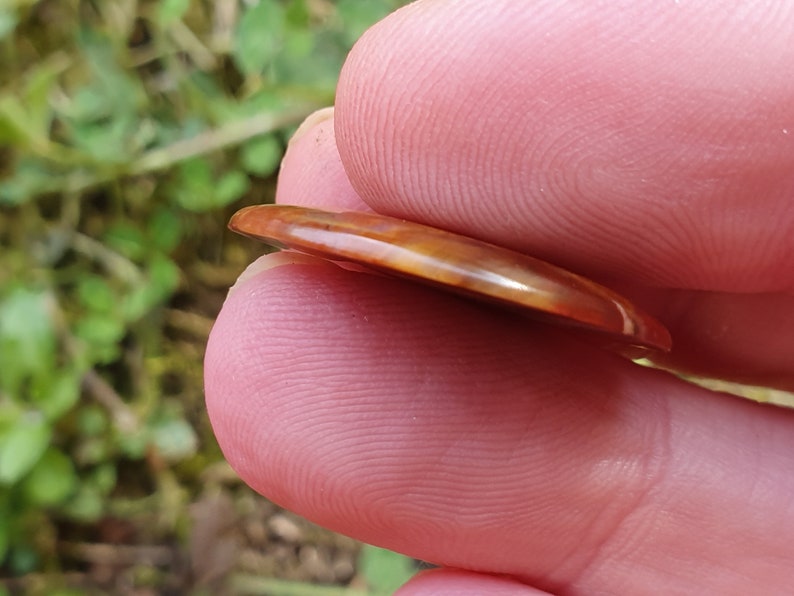 23mm Red Pietersite oval cabochon from Namibia 23 by 16 by 3mm 7cts