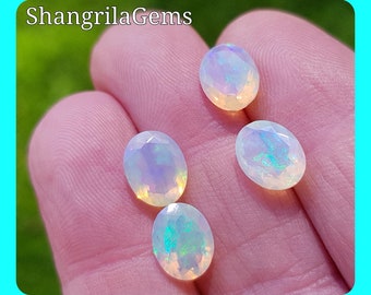 One 9mm by 7mm faceted Ethiopian Opal Blue Green toned Average weight 1ct  AAA