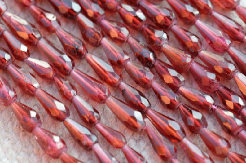 we suggest using 0.010in 0.25mm wire 14 7mm to 10mm Rhodolite Garnet drop shape faceted beads GARR03