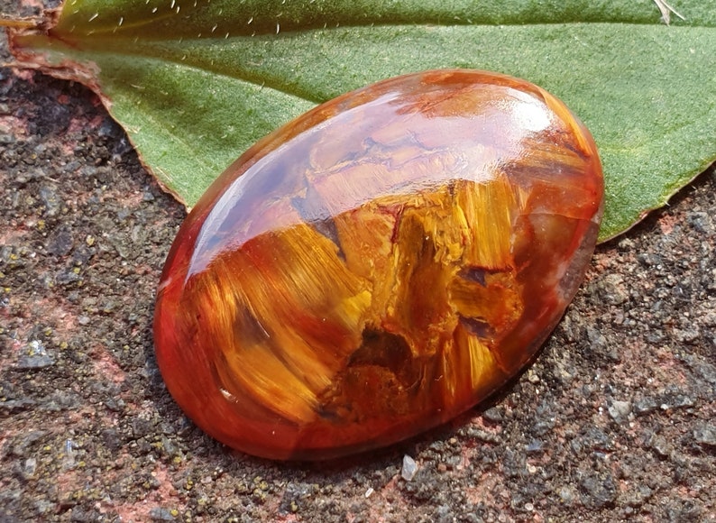 23mm Red Pietersite oval cabochon from Namibia 23 by 16 by 3mm 7cts