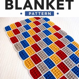 May include: A crochet blanket pattern featuring a grid of rectangular blocks in red, blue, yellow, and gray. Each block has a raised bobble texture. The text CROCHET BLANKET PATTERN is displayed at the top, and stitchawaycrochet.etsy.com is at the bottom.