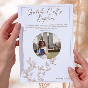 May include: A baptism announcement with the text "Isabella Call's Baptism" in elegant script. The announcement includes a photo of a young person holding a book, surrounded by a quote and floral design. The date "February 9, 2025" is at the bottom.