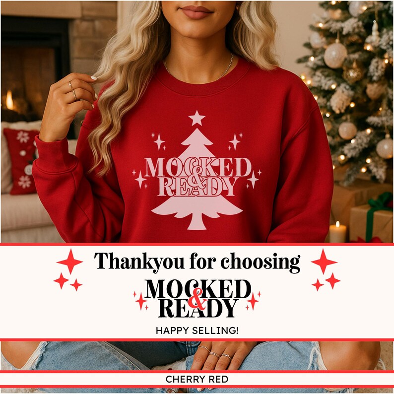 May include: A red crewneck sweatshirt featuring a light pink graphic of a Christmas tree with the text MOCKED & READY centred in the middle. The design includes small star accents surrounding the tree, printed on the front of the garment.