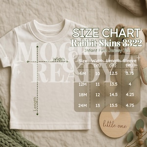 May include: Cream-colored infant fine jersey tee with a size chart for Rabbit Skins 3322. The chart shows measurements in inches for width, length, and sleeve length for sizes 6M, 12M, 18M, and 24M. A wooden disc with "little one" is also visible.