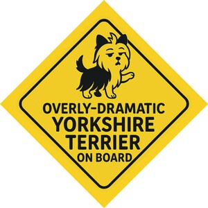 May include: A yellow diamond-shaped sign with a black border and a cartoon Yorkshire Terrier illustration. The text reads "OVERLY-DRAMATIC YORKSHIRE TERRIER ON BOARD" in bold, black letters. The dog is black and tan, with a slightly grumpy expression.