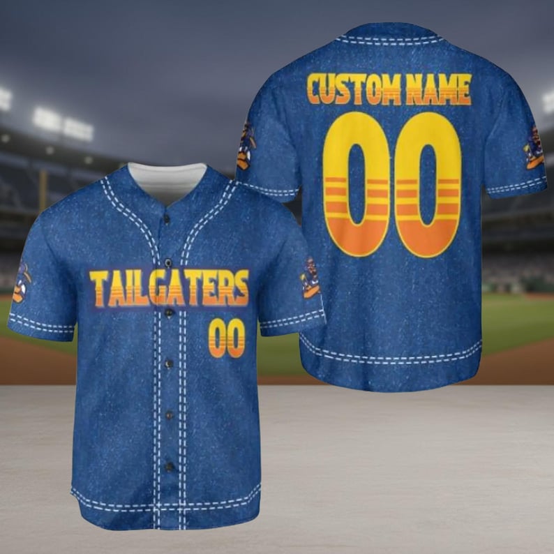 May include: Blue baseball jersey with white stitching and the words "TAILGATERS" and the number "00" in orange. The back of the jersey has the words "CUSTOM NAME" and the number "00" in orange. The jersey has a denim-like appearance.