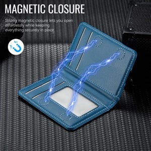 May include: Open blue wallet with white stitching and a magnetic closure. The wallet has card slots and a clear ID window. The text "MAGNETIC CLOSURE" is at the top, with a description of the magnetic closure below.