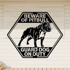 May include: Black and white metal sign with a pitbull dog illustration. The sign is in a black diamond shape with the words "BEWARE OF PITBULL" and "GUARD DOG ON DUTY" in white lettering.