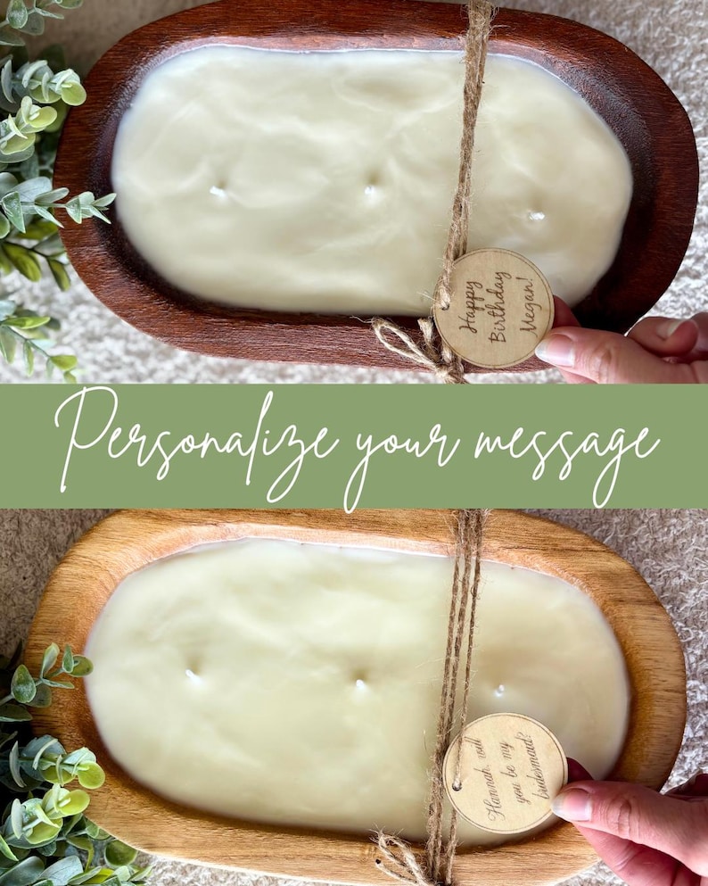 May include: A large, oval candle in a wooden bowl. The cream-coloured candle has multiple wicks. A twine bow holds a wooden tag that reads "Happy Birthday Megan!" The text "Personalize your message" is also visible.