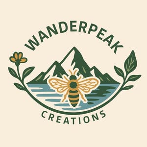 May include: A circular logo with the text "WANDERPEAK CREATIONS" in green. The logo features a stylized bee with outstretched wings, mountains, water, and floral elements, all in a nature-inspired design.