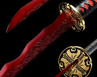 May include: A red katana sword with intricate gold detailing on the guard and handle. The blade features etched designs. The handle is wrapped in black and red fabric. The overall design is ornate and detailed.