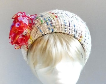 made with passion halo hat in rainbow colours with handmade flower