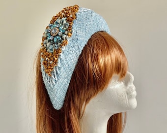 Hand embroidered blue and gold coloured bouclé halo hat with stras brooch.