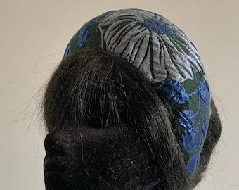 Blue silver and black halo hat with 3 D flower fabric