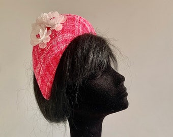 Inspired by the halo hat of the Princess of Wales but with lots of character of its own pink and white bouclé fabric