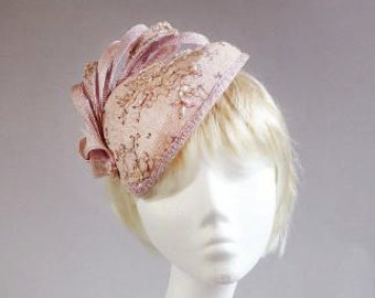 Dutch design dusty pink and soft lavender sinamay base covered with beaded lace on comb