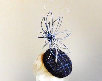 made  with passion deep blue and royal blue bouclé percher hat topped with rattan flower and silver swirs on comb