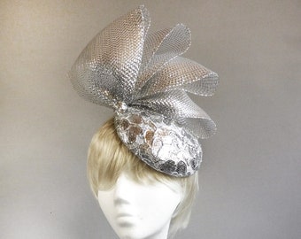 Made with passion silvercoloured fascinator hat made from sinamay shiny fabric and crin on comb