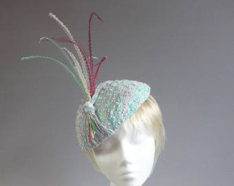 Dutch design bouclé fabric hat in springcolours with ton sur ton feathers on comb