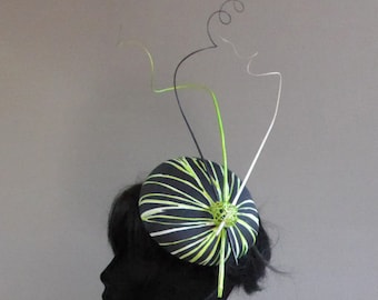 Black and green percher hat with ton sur ton feathers on comb