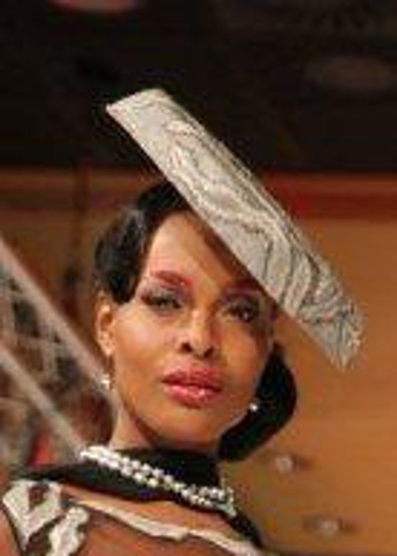 Made with passion black sinamay covered with grey silvery sequined fabric saucer hat on comb