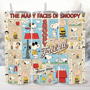 May include: A cylindrical tumbler with a straw featuring a collage of Peanuts comic strip panels. The text reads THE MANY FACES OF SNOOPY, SNOOPY Friend, and Since 1950. The design includes Snoopy, Charlie Brown, and Woodstock in various poses.
