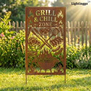 May include: A rusty brown metal sign with the words "GRILL & CHILL ZONE" cut out, along with images of grilling tools, food, and a grill. The sign is placed in a grassy yard with a wooden fence in the background.