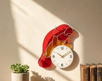May include: A decorative wall clock in the shape of a parrot, crafted from red and yellow stained glass. The clock face is white with black numerals and gold hands. The brand name "Lightinggo" is visible.