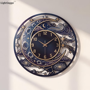 May include: A circular wall clock featuring a dark blue celestial design with a crescent moon, stars, and swirling clouds. The central clock face has gold-colored numerals from 1 to 12 and matching gold hands against a dark blue background.
