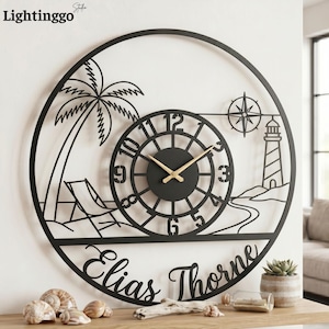 May include: A circular black metal wall clock featuring a coastal scene with a palm tree, a beach chair, a lighthouse, and a compass rose. The center dial has gold hands and numerals. The name Elias Thorne is cut out in script at the bottom.