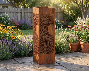 May include: A tall, rectangular, weathered metal garden lantern with a wave design cut into the sides. The lantern is a rusty brown colour and stands on a stone patio, surrounded by flowers and greenery. The text "Lightinggo" is in the top right corner.