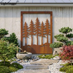 May include: A rusty brown metal wall art piece featuring a cut-out design of pine trees within a rectangular frame. The artwork is mounted on a concrete wall, complemented by a Japanese garden with stone pathways, greenery, and a water feature.
