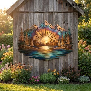 May include: A metal wall art piece featuring a mountain range, a sunburst, a forest of pine trees, and a reflective lake. The artwork displays a gradient of heat-treated colors including shades of blue, purple, gold, and copper tones.
