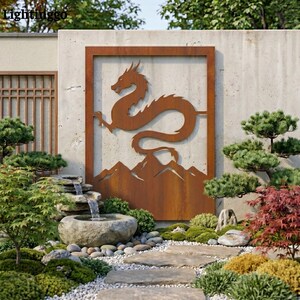 May include: A rusty brown metal dragon wall art piece set within a rectangular frame. The artwork is mounted on a concrete wall, with a mountain range design below the dragon. The scene includes a garden with a stone path and a small waterfall feature.