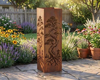 May include: A tall, rectangular, rusty-brown metal planter with a detailed tree design cut into the sides. The tree's roots, trunk, and branches are visible. The planter is outdoors, surrounded by a garden.