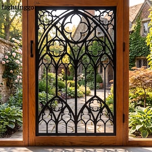 May include: A wooden door frame featuring a black metal insert with an intricate gothic arch pattern. The design includes pointed arches and quatrefoil motifs. The text Lightinggo is visible in the top left corner of the wooden frame.