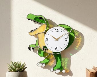 May include: A green and yellow dinosaur-shaped wall clock with a white clock face. The clock has a playful design, with the dinosaur's body forming the clock's frame. The clock hands are gold. The brand name "Lightinggo" is in the top left corner.