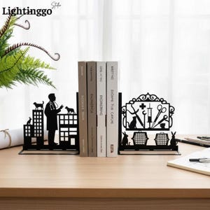 May include: A pair of black metal bookends featuring veterinary themes. The left piece depicts a veterinarian standing by a building with a dog and cat. The right piece displays medical tools, a syringe, a cross, and two pet carriers.