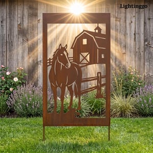 May include: A rectangular metal garden screen with a rust-colored finish featuring a laser-cut silhouette of a horse standing in front of a barn and a wooden fence. The panel is supported by two thin metal stakes at the base for ground installation.