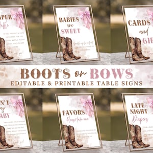 May include: A collection of printable table signs with a rustic theme. Each sign features watercolor illustrations of cowboy boots and a pink bow, with text such as "Diaper Raffle" and "Cards and Gifts". The signs are displayed in gold frames.