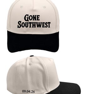 May include: A two-tone baseball cap with a cream-colored crown and a black brim. The front features the black text GONE SOUTHWEST. The side of the cap displays the black text 09.04.26. The cap has a structured five-panel design with a black button.