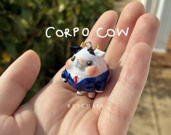 corpo cow | handmade polymer clay keychain, black and white cow wearing a suit and tie, kawaii corporate cow charm